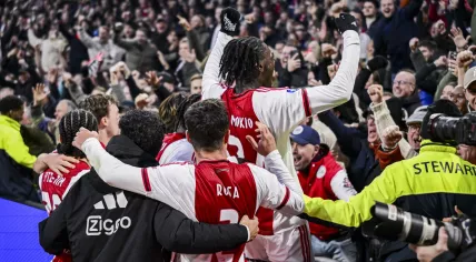 Ko Itakura, Lucas Rosa, and Jorthy Mokio of Ajax celebrate the 2–0 during the Dutch Eredivisie match between AFC Ajax and Feyenoord at the Johan Cruijff ArenA on December 14, 2025, in Amsterdam, Netherlands.