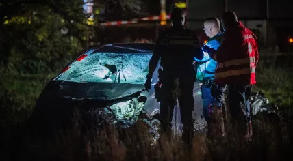 Investigators inspect a hatchback that crashed into a group of people gathered for a parade in Nunspeet. 22 Dec. 2025