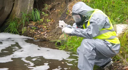 Scientist checks water body for possible contamination