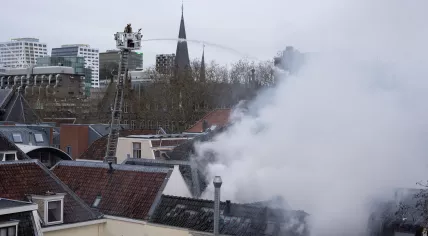 Firefighters try to extinguish flames after an explosion took place on Visscherssteeg in the city center of Utrecht. 15 Jan. 2026