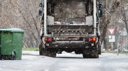 Garbage truck in snow