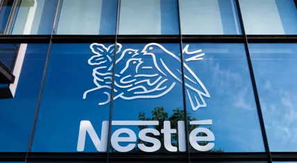 Issy-les-Moulineaux, France - May 18, 2024: Sign and logo on the French headquarters building of Nestl. Nestl is a Swiss multinational food and drink processing conglomerate corporation