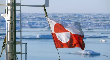 The flag of Greenland on a tourist boat mast.