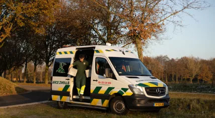Animal ambulance volunteer in an animal ambulance with cages for animals