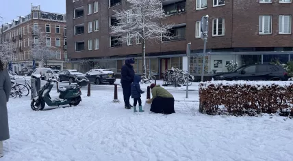 A family building a snowman in Amsterdam-Oost. 5 Jan. 2026