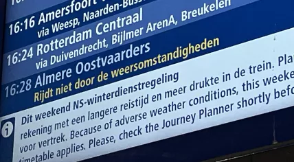 Winter timetable notice at an Amsterdam train station