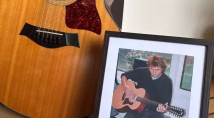 George Kooymans' accousting Taylor guitar is up for auction to raise funds for ALS research, January 2026