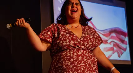 Nadine Froughi performing on stage in August 2024