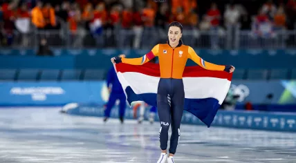 Femke Kok takes gold in the 500m speed skating event at the Milano Speed Skating Stadium during the Milan Winter Olympics.