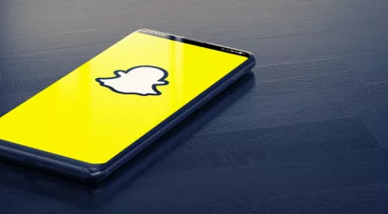Snapchat logo on a smartphone screen