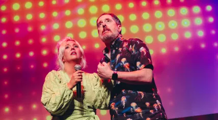 Stacey Smith and Brendan Hunt on stage during the 2024 Boom Chicago Comedy Festival. July 2024