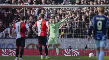 AFC Ajax goalkeeper Maarten Paes prepares for a penalty taken by Feyenoord’s Jakub Moder during the Dutch Eredivisie match between Feyenoord and AFC Ajax at De Kuip stadium on March 22, 2026, in Rotterdam, Netherlands.