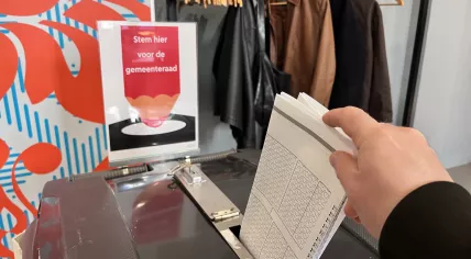 A voter casting their ballot in Amsterdam for the municipal elections on 18 March 2026