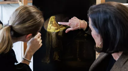 Researchers look at the Vision of Zacharias in the Temple (1633) by Rembrandt van Rijn.
