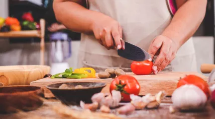 Woman prepping food in a kitchen