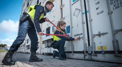 Dutch customs officers opening a container