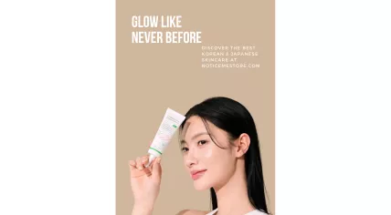 A promotional photo of a woman holding a bottle of AXIS-Y Complete No-Stress Physical Sunscreen
