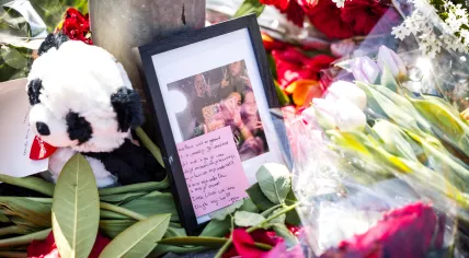 Flowers at a home on Elzenstraat, where a girl died following a stabbing incident. A man and a woman, the residents of the property, have been arrested.