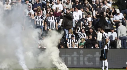 Heracles supporters throw fireworks onto the pitch during the Dutch Eredivisie match between Heracles Almelo and FC Volendam at Erve Asito Stadium on April 26, 2026, in Almelo, Netherlands.