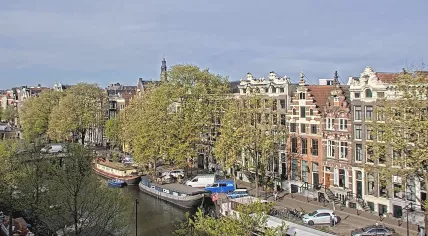 The Westerkerk rising above the treetops looking southwest along the Singel in Amsterdam-Centrum. 28 April 2026
