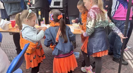 Kids at a King's Day flea market in Amsterdam, 27 April 2026