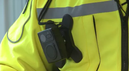 An NS security worker wearing a bodycam