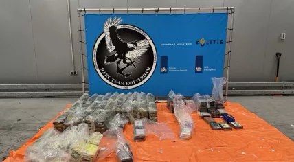 Dutch authorities have arrested four suspects in Lochem after uncovering 365 kilograms of cocaine hidden in a shipment of household goods from Curaçao. April 2026.