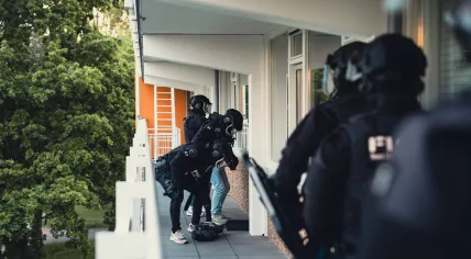Cargo HARC-team officers during cocaine smuggling investigation linked to Schiphol Airport. 2026