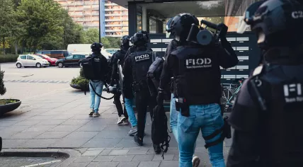 Cargo HARC-team officers during cocaine smuggling investigation linked to Schiphol Airport. 2026