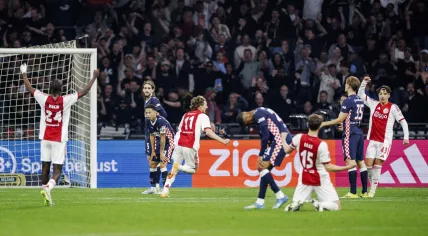 Ajax players celebrate Mika Godts' injury time equalizer against PSV, May 2, 2026.