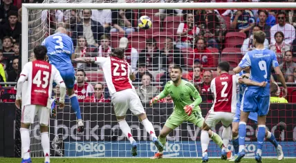 Mike van der Hoorn of FC Utrecht scores the 1-2 goal past AFC Ajax players Wout Weghorst and goalkeeper Maarten Paes during the Dutch Eredivisie match between AFC Ajax and FC Utrecht at the Johan Cruijff ArenA on May 10, 2026, in Amsterdam, the Netherlands.