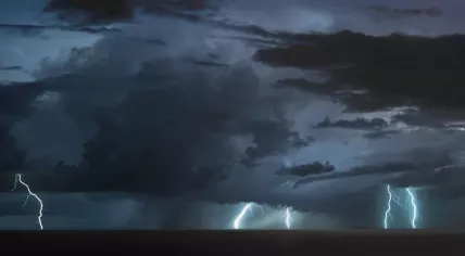 A thunderstorm with lightning. 