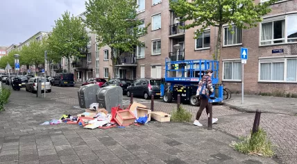 Trash surrounding full bins on an Amsterdam street, 15 May 2026