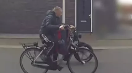 Missing 14-year-old Maxim on a bicycle that he is believed to have used to flee the country.