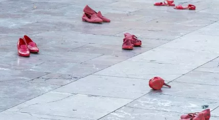 Red shoes placed in a protest to represent the victims of femicide 