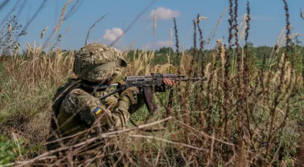 An undated photo of a Ukrainian solider preparing to fire an AK-47 rifle.
