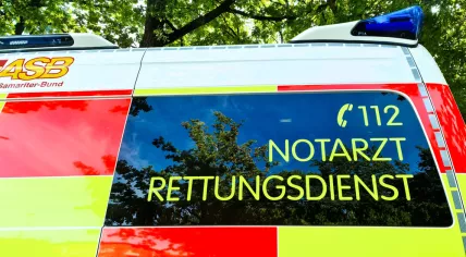 ASB Rettungsdienst ambulance parked outdoors, showing medical assistance and 112 emergency number