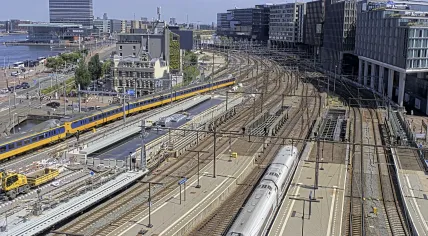 A NS train leaves Amsterdam Centraal headed east on a hot Tuesday afternoon. 23 June 2026