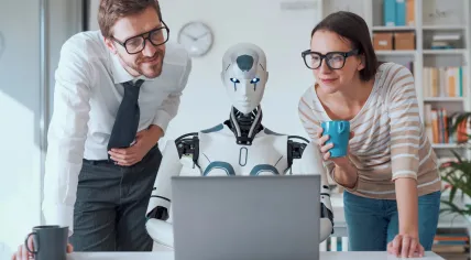AI in the workplace concept: Office workers working with a robot