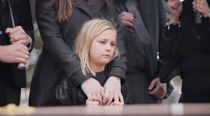 Child at a funeral