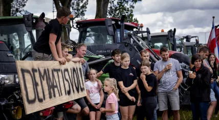 Farmers, their families standing by their trucks during a protest against the Dutch government’s nitrogen plans. July 27, 2026.