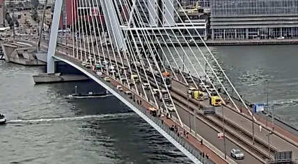 Rescue workers raced to the scene where a tram rear-ended a second tram on the Erasmus Bridge in Rotterdam, leaving 15 hurt. 22 July 2026