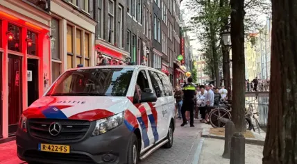 Police raid multiple locations in Amsterdam's Red Light District as part of a major operation against human trafficking, 14 July 2026