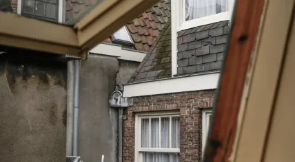 View through an open window of the facades of an interior patio in Amsterdam