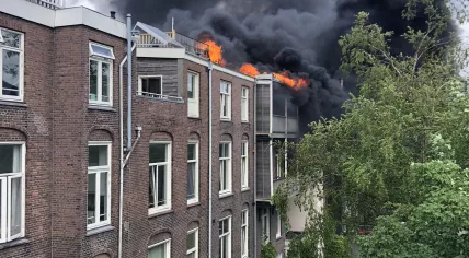 Fire swept across the rooftops on Ruyschstraat in Amsterdam-Oost. May 23, 2020