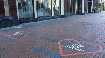 Social distancing reminders on the Nieuwendijk, a major shopping street in Amsterdam Centrum. May 28, 2020