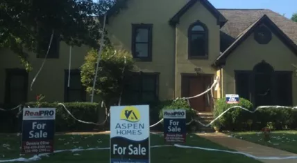 For sale sign in front of a house. (Source: Twitter/@MurphyMeyer)