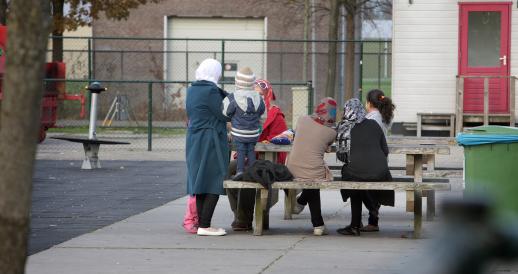 A small group of people gathered at the Ter Apel asylum seeker reception center in November 2014