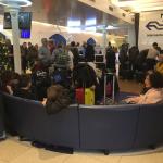 Train passengers waiting in Amsterdam NS lounge