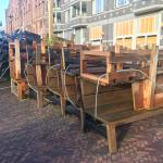 Tables, chairs and benches piled up outside of Nomads restaurant in Amsterdam Oost. 28 October 2020